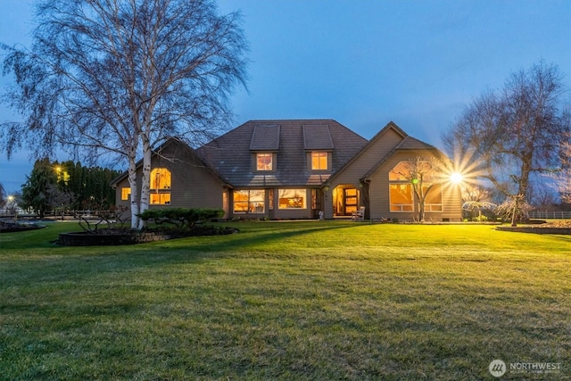 view of front of house with a yard