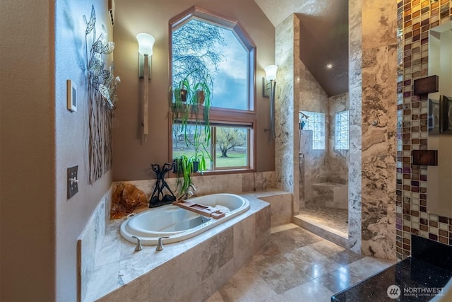 full bath featuring a garden tub and walk in shower