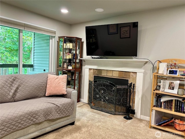 23321 Cedar Way Unit J204, Mountlake Terrace, WA 98043 - carpeted living room featuring a tile fireplace and recessed lighting