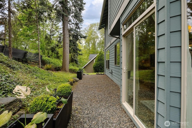 view of home's exterior featuring a vegetable garden