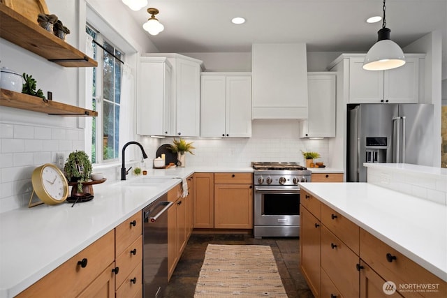 kitchen with light countertops, stainless steel appliances, open shelves, and a sink