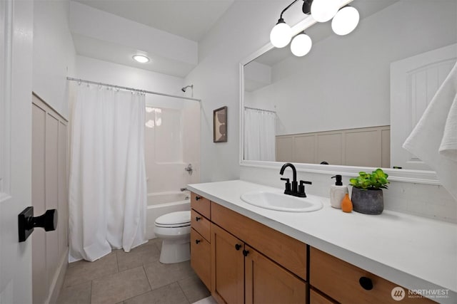 full bath featuring toilet, tile patterned flooring, vanity, and shower / bath combination with curtain
