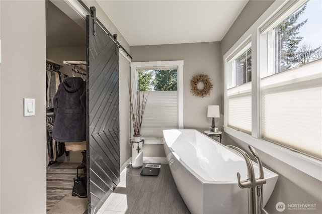 16005 SE Lake Holm Rd, Auburn, WA 98092 - full bathroom featuring a freestanding tub and baseboards