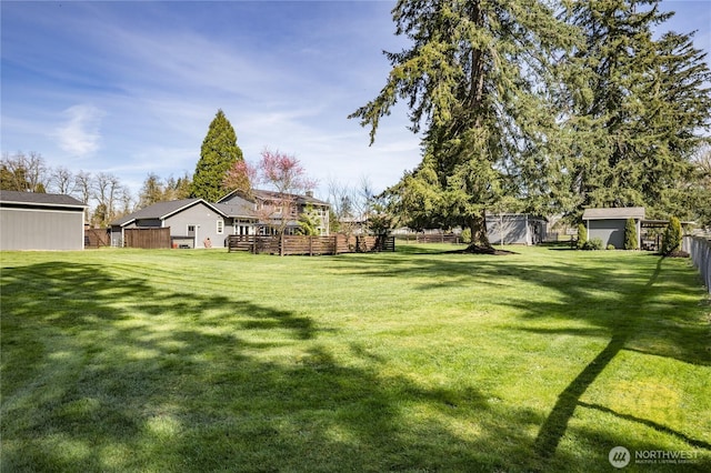16005 SE Lake Holm Rd, Auburn, WA 98092 - view of yard featuring an outbuilding, fence, a storage shed, and a deck