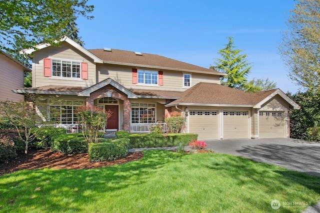 15117 272nd Pl NE, Duvall, WA 98019 - view of front facade featuring a front lawn, driveway, and a garage