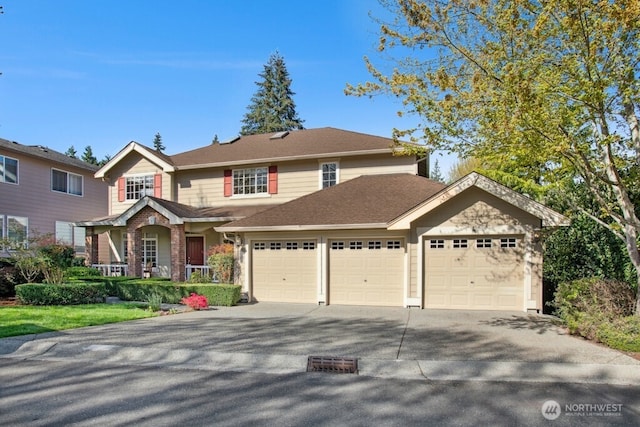 15117 272nd Pl NE, Duvall, WA 98019 - traditional-style home featuring driveway, covered porch, and a garage