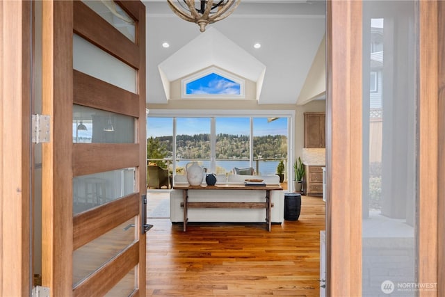 11230 SE 76th Pl, Newcastle, WA 98056 - interior space featuring a water view, high vaulted ceiling, wood finished floors, and recessed lighting