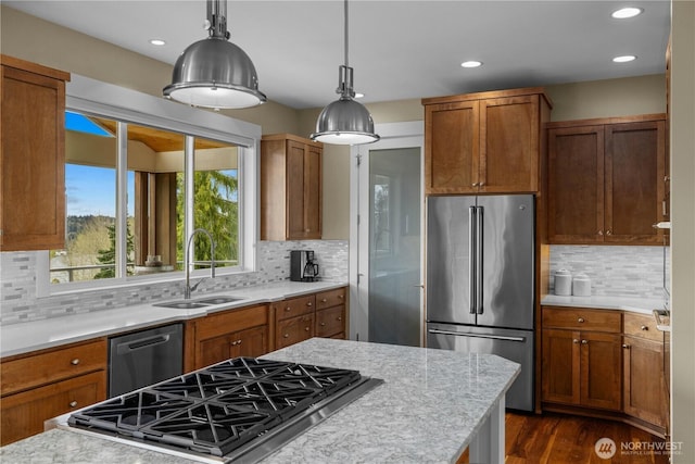 11230 SE 76th Pl, Newcastle, WA 98056 - kitchen featuring dishwashing machine, a sink, brown cabinetry, and high end refrigerator