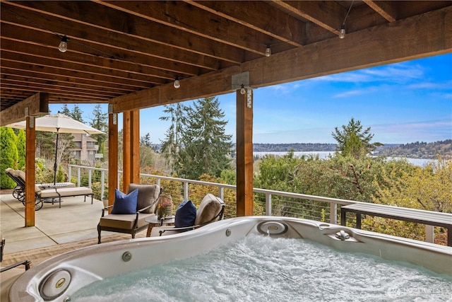 11230 SE 76th Pl, Newcastle, WA 98056 - view of patio / terrace featuring a hot tub and a forest view