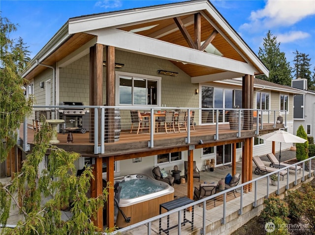 11230 SE 76th Pl, Newcastle, WA 98056 - rear view of property with a hot tub and a patio area