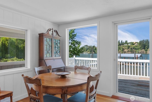 275 State Route 409, Cathlamet, WA 98612 - dining space featuring a water view, a wealth of natural light, and light wood-style flooring