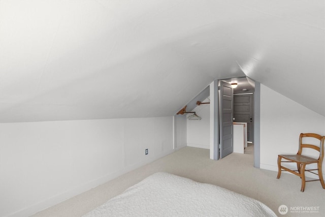 275 State Route 409, Cathlamet, WA 98612 - carpeted bedroom featuring baseboards and lofted ceiling