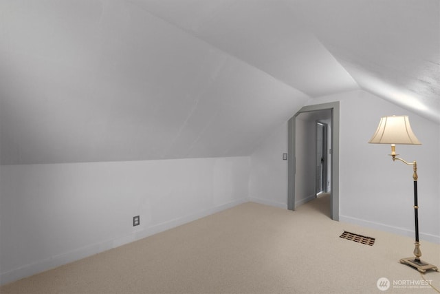 275 State Route 409, Cathlamet, WA 98612 - additional living space featuring baseboards, carpet floors, visible vents, and vaulted ceiling