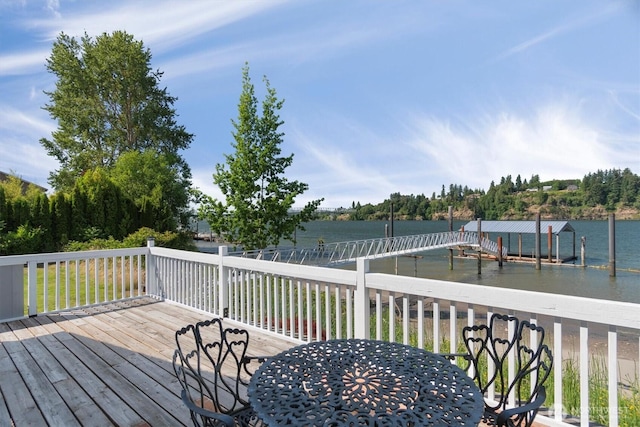 275 State Route 409, Cathlamet, WA 98612 - deck featuring a dock, a water view, and outdoor dining space