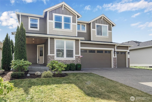 view of front of house with stone siding, a garage, board and batten siding, and concrete driveway