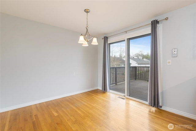13729 8th Ave S, Burien, WA 98168 - empty room with a chandelier, light wood-style flooring, visible vents, and baseboards