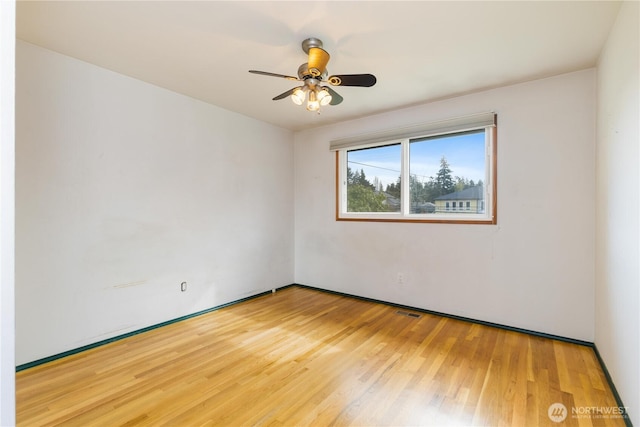 13729 8th Ave S, Burien, WA 98168 - spare room featuring a ceiling fan, wood finished floors, and visible vents