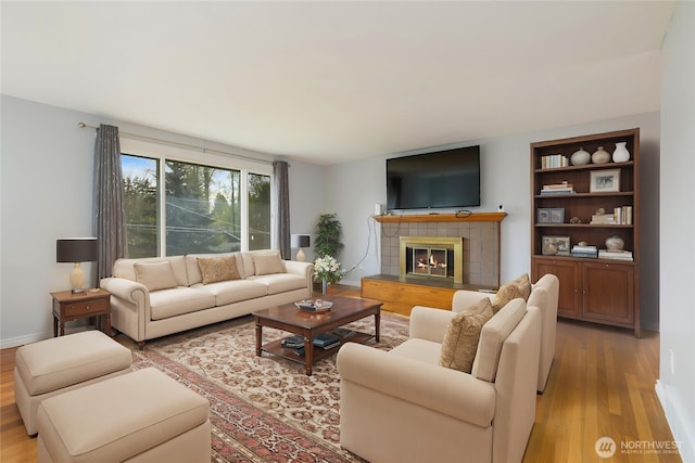 13729 8th Ave S, Burien, WA 98168 - living room featuring a tile fireplace and light wood finished floors