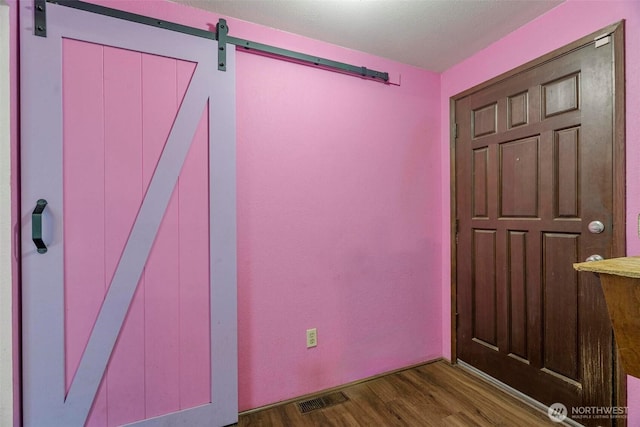 4901 Delta Ln SE, Tumwater, WA 98501 - foyer featuring a barn door and wood finished floors