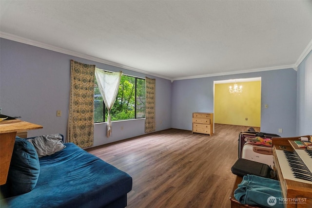 4901 Delta Ln SE, Tumwater, WA 98501 - living room featuring crown molding, a chandelier, and wood finished floors