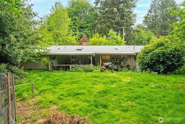 4901 Delta Ln SE, Tumwater, WA 98501 - back of house featuring a chimney and a yard