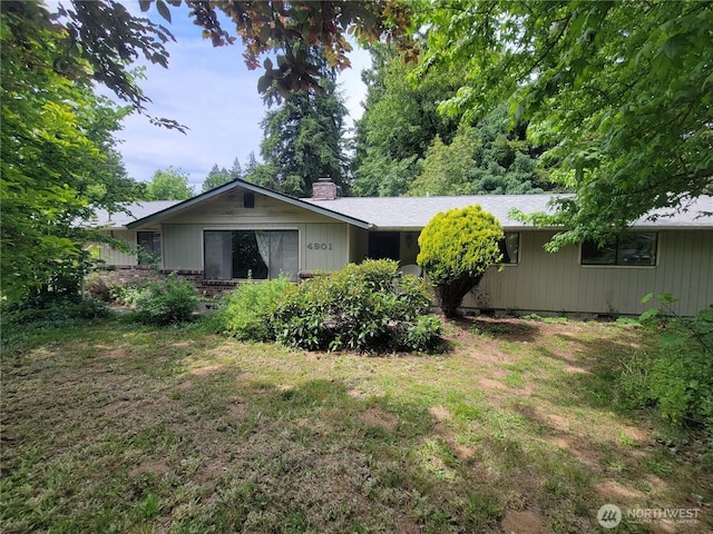4901 Delta Ln SE, Tumwater, WA 98501 - back of property with a chimney and a lawn