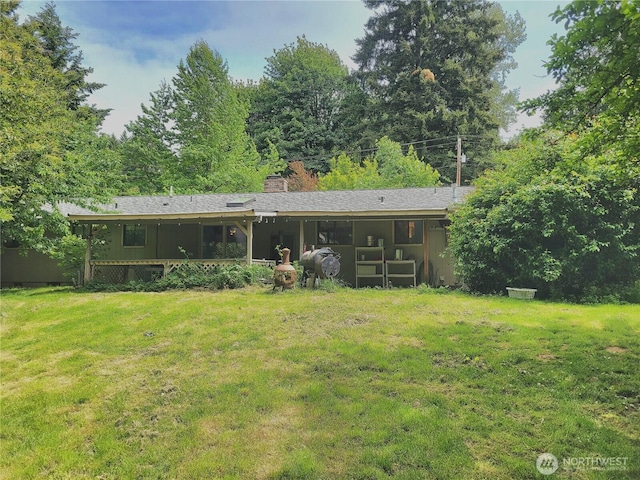 4901 Delta Ln SE, Tumwater, WA 98501 - back of property featuring a chimney and a lawn