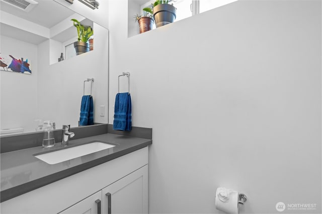 bathroom with visible vents and vanity