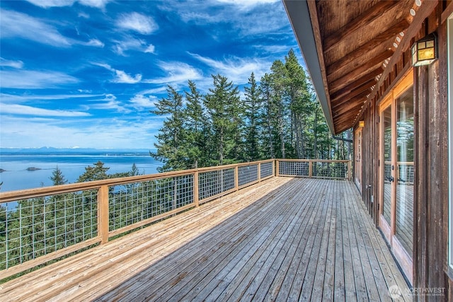wooden terrace with a water view