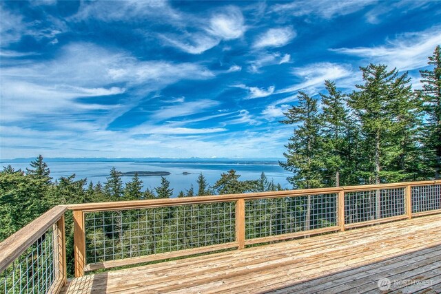 wooden terrace featuring a water view