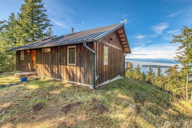 view of outbuilding featuring a water view