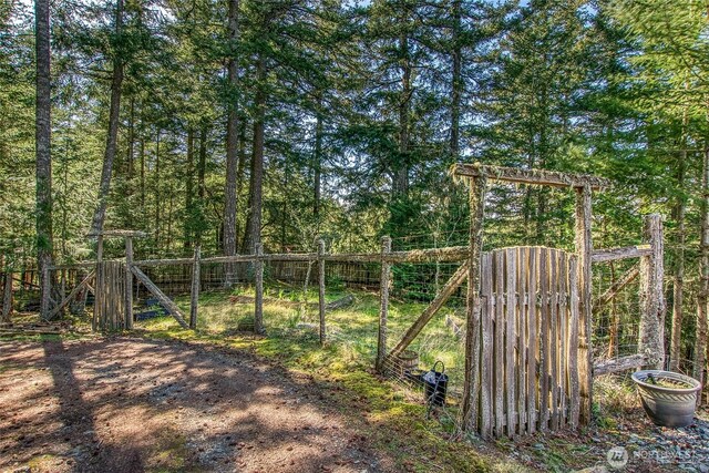 view of gate featuring fence