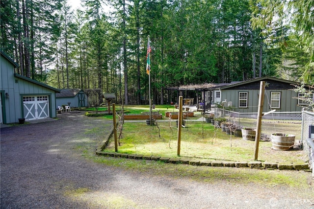 view of front of home with fence, board and batten siding, and a garage
