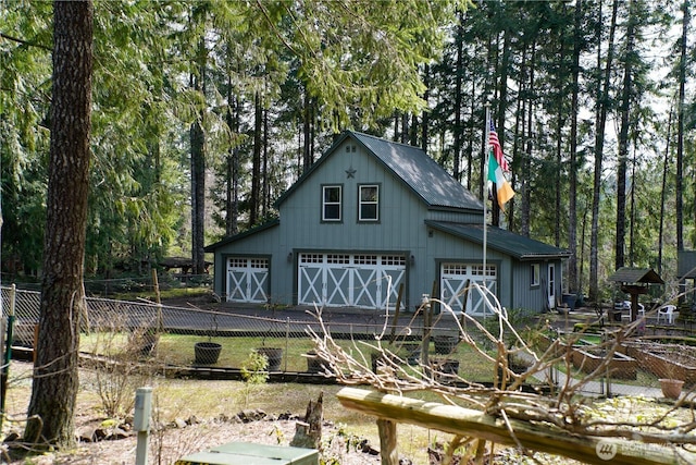 view of outdoor structure featuring fence