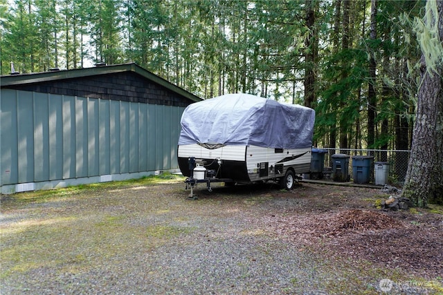 view of outdoor structure featuring fence