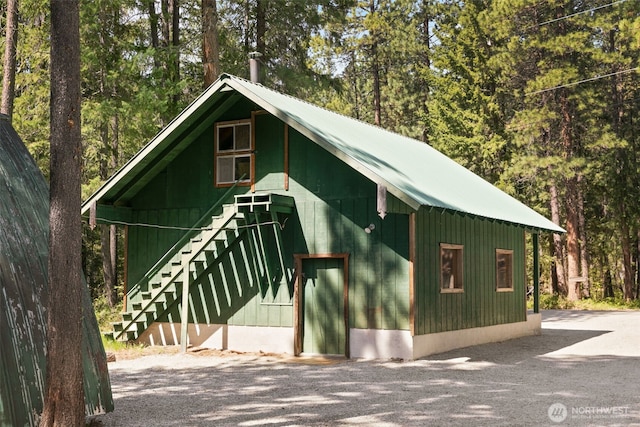 view of outbuilding with stairs