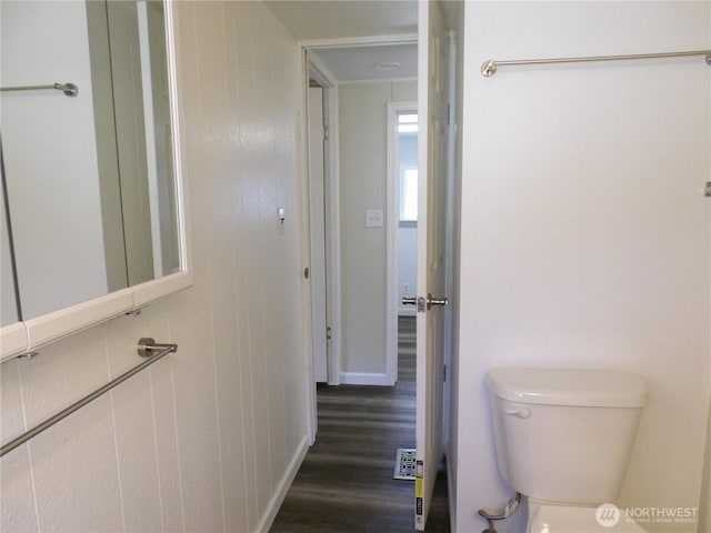 bathroom featuring toilet and wood finished floors