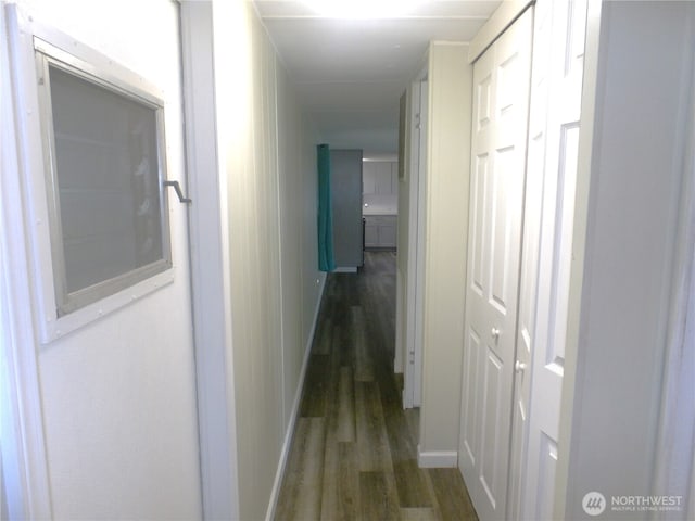 corridor featuring wood finished floors