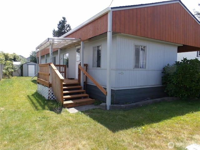 1308 263rd Pl, Ocean Park, WA 98640 - back of property featuring a shed, a yard, and a wooden deck