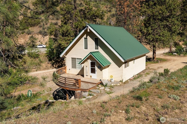 view of front facade with a deck and metal roof