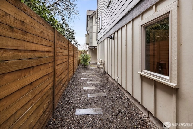 3924 S Brandon St Unit A, Seattle, WA 98118 - view of home's exterior with fence and board and batten siding