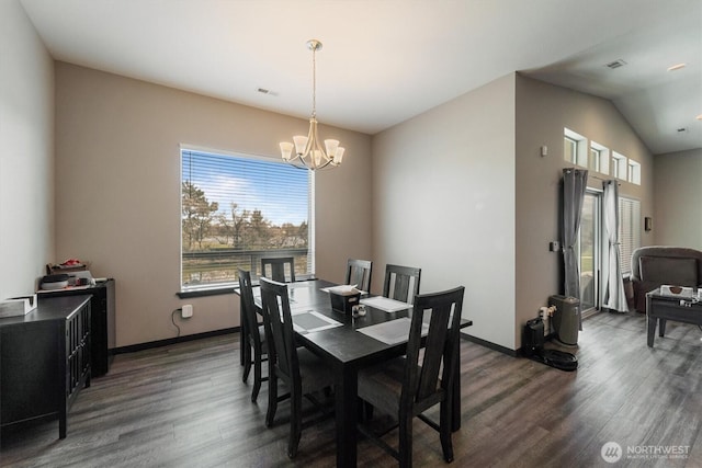dining space featuring a chandelier, plenty of natural light, dark wood-type flooring, and visible vents