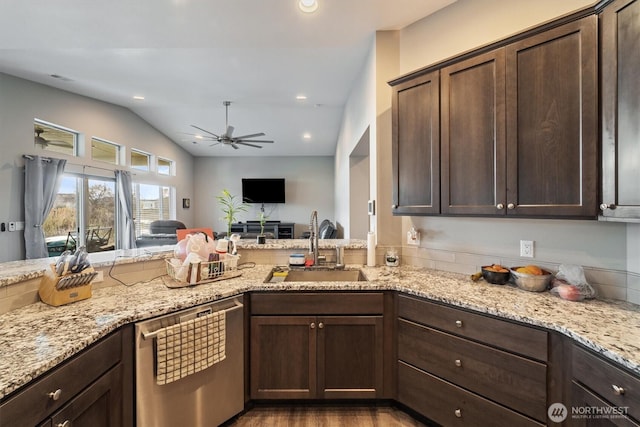 kitchen with dishwasher, a sink, a ceiling fan, dark brown cabinets, and vaulted ceiling