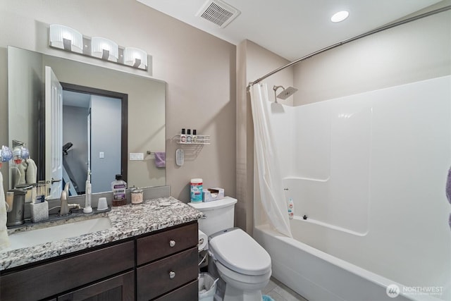 full bathroom with shower / tub combo with curtain, vanity, visible vents, and toilet