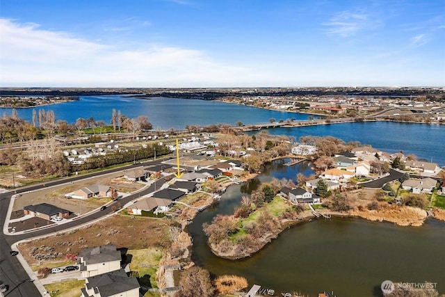 bird's eye view featuring a water view and a residential view