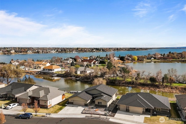 bird's eye view with a residential view and a water view