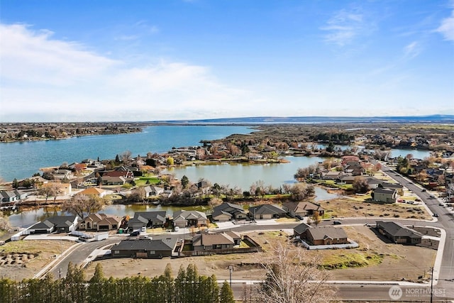 bird's eye view with a water view and a residential view
