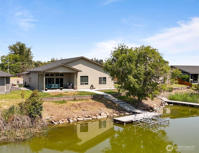3435 W Blue Heron Ln, Moses Lake, WA 98837 - rear view of house featuring a water view and a patio area