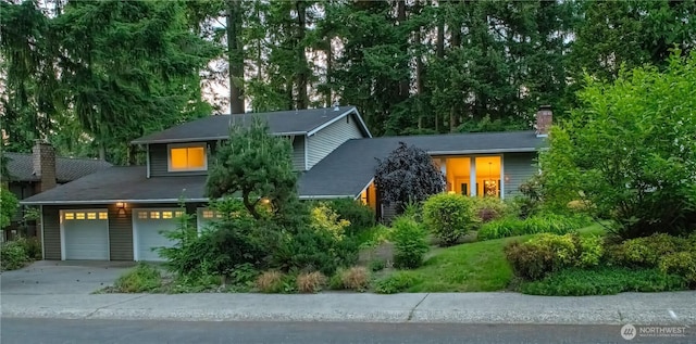 16438 SE 22nd St, Bellevue, WA 98008 - view of front of home with concrete driveway, a chimney, and a garage