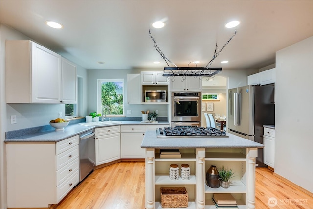 9300 138th Ct NE, Redmond, WA 98052 - kitchen featuring open shelves, light countertops, white cabinets, a sink, and stainless steel appliances